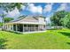 Spacious backyard with screened patio, and lush lawn at 3706 Andover Cay Blvd, Orlando, FL 32825