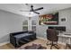 Comfortable bedroom with a daybed, desk, ceiling fan, and views from a large window at 3706 Andover Cay Blvd, Orlando, FL 32825