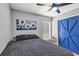 Nicely staged bedroom with ceiling fan and wood look flooring at 3706 Andover Cay Blvd, Orlando, FL 32825
