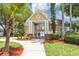 Community clubhouse with manicured landscaping and secure entrance at 3706 Andover Cay Blvd, Orlando, FL 32825