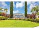 Community entrance sign amidst lush green landscaping at 3706 Andover Cay Blvd, Orlando, FL 32825