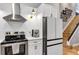 White kitchen features stainless steel appliances, white subway tile and breakfast bar at 3706 Andover Cay Blvd, Orlando, FL 32825