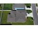 Aerial view of a gray roof with skylights of a home with green grass in the yard at 3823 Spruce Creek Dr, Lakeland, FL 33811