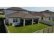 Aerial view of the fenced backyard and screen-enclosed lanai at 3823 Spruce Creek Dr, Lakeland, FL 33811