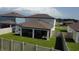 Aerial view of the fenced backyard and screen-enclosed lanai at 3823 Spruce Creek Dr, Lakeland, FL 33811