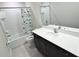 Well-lit bathroom with a tub and shower combo, showcasing a spacious vanity area and ample mirror space at 3823 Spruce Creek Dr, Lakeland, FL 33811