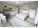 Cozy bedroom with light gray walls and wood-look floors, providing a serene living space at 3823 Spruce Creek Dr, Lakeland, FL 33811