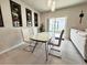 Dining area with glass table and comfortable seating at 3823 Spruce Creek Dr, Lakeland, FL 33811
