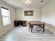 Dedicated dining room with wood-look floors and ample natural light at 3823 Spruce Creek Dr, Lakeland, FL 33811