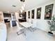 Bright dining room with modern table and chairs next to kitchen at 3823 Spruce Creek Dr, Lakeland, FL 33811