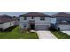 Attractive two-story home with a well-manicured lawn and attached two-car garage at 3823 Spruce Creek Dr, Lakeland, FL 33811