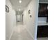 Clean hallway with tile floors and dark cabinets at 3823 Spruce Creek Dr, Lakeland, FL 33811