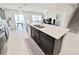 Modern kitchen island with stainless steel appliances and open floor plan at 3823 Spruce Creek Dr, Lakeland, FL 33811