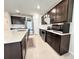 Spacious kitchen featuring stainless steel appliances, dark cabinetry, and a large island with sink at 3823 Spruce Creek Dr, Lakeland, FL 33811