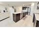 Bright, open kitchen featuring an island with a sink, stainless appliances, and stylish cabinets at 3823 Spruce Creek Dr, Lakeland, FL 33811