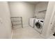 Efficient laundry room with modern appliances and plenty of space for sorting and folding at 3823 Spruce Creek Dr, Lakeland, FL 33811