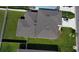 Aerial view of home's roof and backyard with a vehicle in the driveway at 3823 Spruce Creek Dr, Lakeland, FL 33811