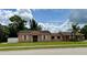 Charming single-story home featuring white-trimmed windows and a well-maintained lawn at 385 Lynchfield Ave, Altamonte Springs, FL 32714