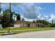 A single-story house with a well-kept lawn and neutral color scheme at 385 Lynchfield Ave, Altamonte Springs, FL 32714