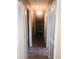Hallway with storage closets and neutral color palette at 385 Lynchfield Ave, Altamonte Springs, FL 32714