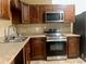 Charming kitchen features wooden cabinets, countertops and stainless steel appliances at 385 Lynchfield Ave, Altamonte Springs, FL 32714