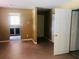 Spacious living room with a window, closet, and view into a kitchen area at 385 Lynchfield Ave, Altamonte Springs, FL 32714