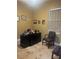 Office with tile floors, desk, chairs, and decorations at 385 Lynchfield Ave, Altamonte Springs, FL 32714