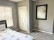 Neutral toned bedroom with closet, double hung window, and carpeted floors at 4011 Venetian Bay Village # 104, Kissimmee, FL 34741