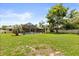 Expansive backyard with a screened pool, patio area, and plenty of green space, perfect for relaxation and recreation at 548 Timber Ridge Dr, Longwood, FL 32779