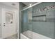 Bathroom with tub, tiled shower, glass doors, tiled walls, and tile floor at 548 Timber Ridge Dr, Longwood, FL 32779