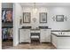 Elegant primary bathroom with double vanity, soaking tub, and open closet showcasing a diverse wardrobe at 548 Timber Ridge Dr, Longwood, FL 32779