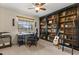 Carpeted bedroom features a desk and chair and a bookshelf with ladder at 548 Timber Ridge Dr, Longwood, FL 32779