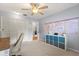 Bedroom with carpet floor, ceiling fan, desk, shelving, and closet at 548 Timber Ridge Dr, Longwood, FL 32779
