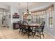 Dining room with dark wood table and chairs, and decorative window treatment at 548 Timber Ridge Dr, Longwood, FL 32779