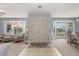 Bright foyer with tiled flooring, double doors, and bay windows offering a glimpse into the living spaces at 548 Timber Ridge Dr, Longwood, FL 32779