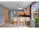 Cozy kitchen bar with wooden cabinets, stainless appliances, and breakfast bar seating at 5852 Mariposa Cove Ln, Orlando, FL 32822