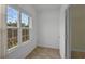 Bright room with two large windows, tile flooring, and neutral walls at 5852 Mariposa Cove Ln, Orlando, FL 32822