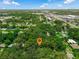 Aerial view showcases property amidst tree-lined streets and proximity to local shops and businesses at 610 Kittredge Dr, Orlando, FL 32805