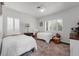 Shared bedroom showcasing bright natural light, twin beds, and decorative rug at 610 Kittredge Dr, Orlando, FL 32805