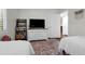 Shared bedroom with two twin beds, a TV, hardwood floors, and white walls at 610 Kittredge Dr, Orlando, FL 32805