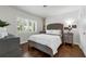 Bedroom with hardwood floors, white walls, and natural light shining through the windows at 610 Kittredge Dr, Orlando, FL 32805
