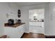 Inviting coffee bar area with a built-in countertop and direct access to the bright, updated kitchen at 610 Kittredge Dr, Orlando, FL 32805