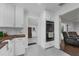 White kitchen with gray tile flooring and butcher block counters offers a sleek double oven at 610 Kittredge Dr, Orlando, FL 32805