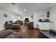 Spacious living area with hardwood floors, a coffee bar, fireplace and built in shelves, ideal for entertaining guests at 610 Kittredge Dr, Orlando, FL 32805
