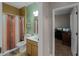 Bathroom featuring a shower with curtain, a vanity, and a glimpse into an adjacent office at 7621 Brightwater Pl, Oviedo, FL 32765