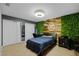 Bedroom with accent wall, office setup and recessed lighting at 7621 Brightwater Pl, Oviedo, FL 32765
