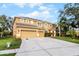 Two-story home with a three car garage and spacious driveway at 7621 Brightwater Pl, Oviedo, FL 32765