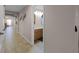 Hallway view with bathroom access, showcasing the home's layout and neutral color scheme at 7621 Brightwater Pl, Oviedo, FL 32765