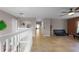 Upstairs landing showcasing tile flooring, white banisters, and a cozy seating area at 7621 Brightwater Pl, Oviedo, FL 32765