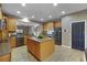 Spacious kitchen features a center island, stainless steel appliances, and a breakfast bar at 7621 Brightwater Pl, Oviedo, FL 32765